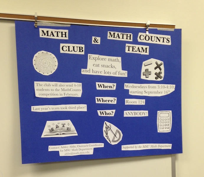 whiteboard with Math Club poster